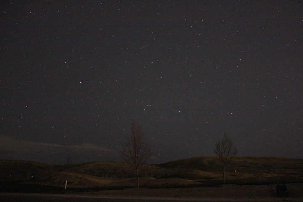 A meteor in the Lyrid shower, hidden to the naked eye, becomes visible in this photo.